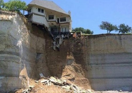 House Falling Off Cliff