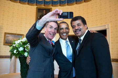 Barack Obama poses for a selfie with Bill Nye, left, and Neil DeGrasse Tyson in the Blue Room prior to the White House Student Film Festival - Public Domain