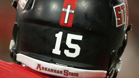 Football team forced to remove Christian crosses from helmets